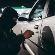 A theft wearing a black mask opening a car door